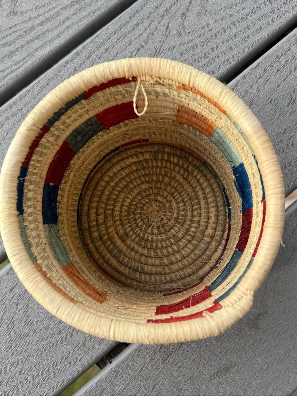 Handwoven Natural Basket with Red and Blue Accents